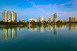 Sarasota skyline with tranquil waters reflecting buildings during evening hours, Florida, United States