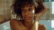 © AdnanArif - Relaxing woman brown skin tones warm lighting self care bath time tranquility
