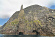 Trøllkonufingur -  imposing rock pillar rising from the sea at the coast of Vágar on the outskirts of Sandavágur.