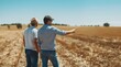 © pvl0707 - Two farmers chatting happily in the lush green grassland