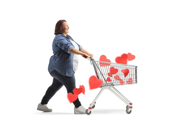 Poster - Full length profile shot of a corpulent woman pushing a shopping cart with hearts