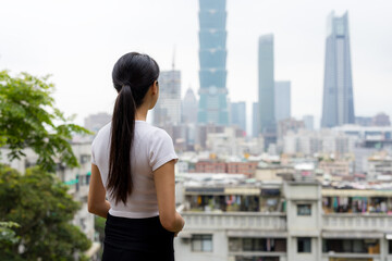 Poster - Woman enjoy the city view in Taipei city