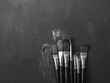 stock photo of paintbrushes featuring mostly charcoal gray --chaos 20 --ar 4:3 Job ID: 65b1d0a3-045d-4fb2-93cd-afeb70ed64c6