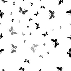 Poster - Seamless vector pattern with butterfly symbols, creating a creative monochrome background with rotated elements. Vector illustration on white background
