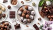 A curated flatlay of gourmet chocolate truffles and pralines, indulgent treats enjoyed during the sweet celebrations of Shavuot.