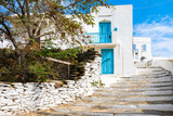 Fototapeta  - View of narrow street with white houses in Apollonia village, Sifnos island, Greece