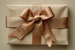 sophisticated natural fabric gift box with copper ribbon on a beige surface