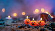 Halloween background, 3 pumpkin shaped candles in the foreground against an out of focus background