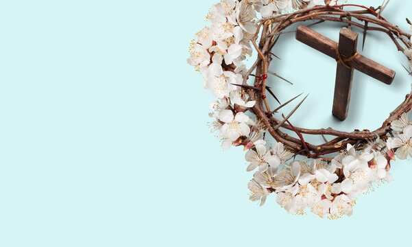 Wooden cross and fresh spring flowers