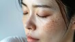 © Mockup Station - The problem of Asian woman's face, freckles, dark spots and wrinkles on the faces of middle-aged women stressed expression, close eyes frowning, dry, darkened, rough skin and facial healthy concept.