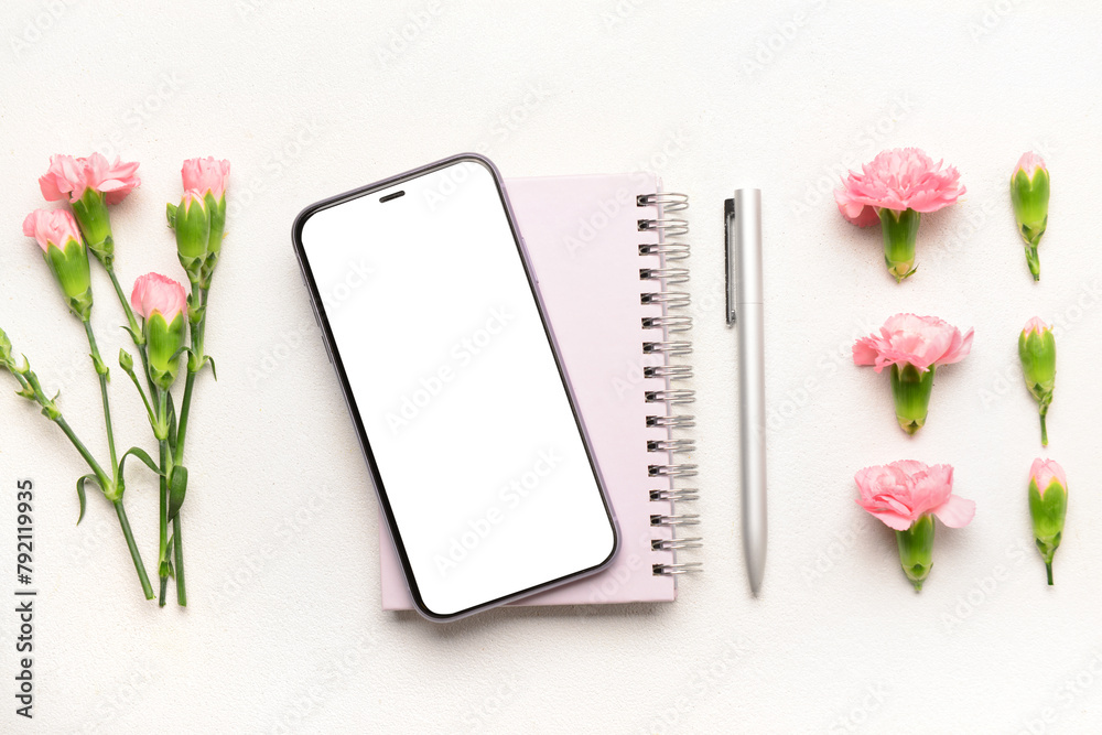 Composition with modern mobile phone, notebook, pen and carnation flowers on light background