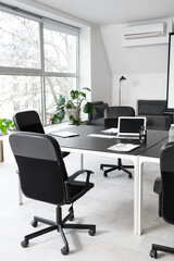 Poster - Black table, armchairs and stationery prepared for business meeting in modern conference hall