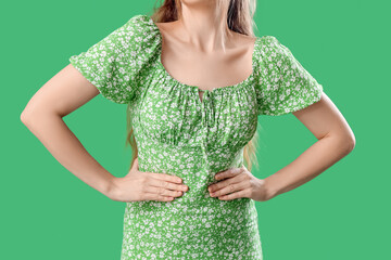 Sticker - Beautiful young woman in stylish dress on green background, closeup