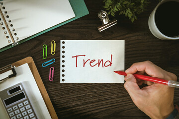 Wall Mural - There is notebook with the word Trend. It is as an eye-catching image.