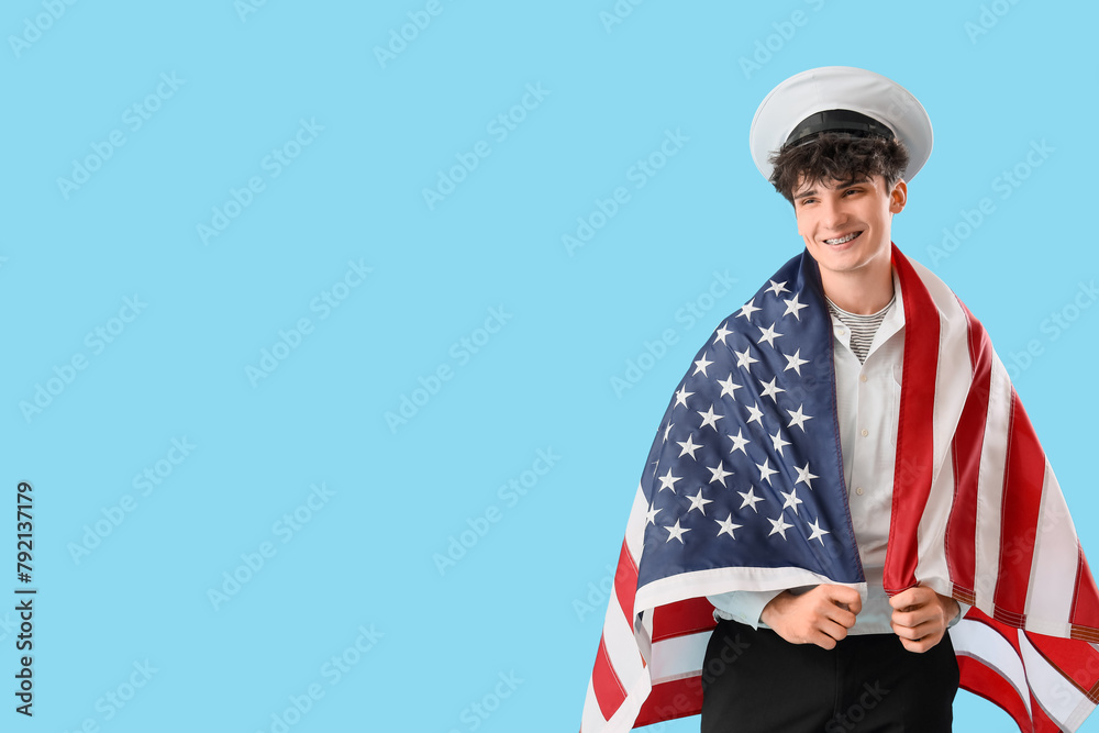 Male sailor with USA flag on blue background