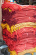 Stacks of red and yellow fabrics at the Ghanta Ghar