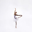 © Acronym - Ballet dancer isolated on white. Beautiful ballerina performing in studio.