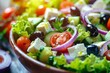 Greek salad made with feta cheese cherry tomatoes red onion cucumber lettuce and black olives Represents healthy eating Delicious and nutritious
