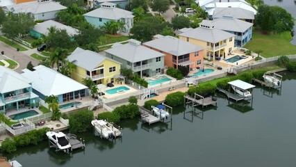 Wall Mural - View from above of waterfront neighborhood in Florida with suburban houses. Development of US seaside premium housing