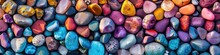 A Vivid Array Of Smoothly Polished Beach Pebbles In Various Colors Creates A Harmonious Texture Perfect For Backgrounds Or Designs.