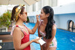 © DragonImages - Smiling mother applying sunscreen on face of teenage daughter