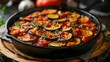 Ratatouille in a Cast Iron Pan: A Classic French Dish on a Rustic Kitchen Table. Concept French Cuisine, Cast Iron Cookware, Rustic Home Decor, Food Photography, Vegetarian Recipes