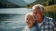 © VistaVisions - Happy caucasian senior pensioner retired couple traveler hiking by lake in blurred nature mountain background