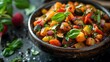 Close-up of homemade ratatouille - a traditional French stewed vegetable dish. Concept French cuisine, Ratatouille recipe, Traditional dishes, Stewed vegetables, Homemade cooking