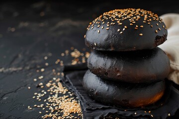 Wall Mural - Sesame seeds on dark pastry over black table