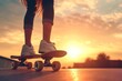 Skateboarding girl s legs at sunset Sun backlight and independent concept Active day for board hobby