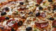 Closeup of a crispy woodfired pizza topped with a variety of fresh toppings such as prosciutto mushrooms and olives all melting together in gooey cheese. .