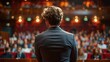 back view of man in business suit giving a speech on the stage in front of the audience,art photo