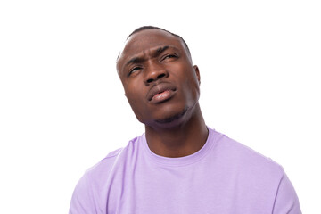 Wall Mural - close-up portrait of a young proud american man dressed in a light lilac t-shirt on a white background with copy space