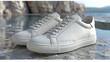 A pair of white sneakers  shoes with clean lines, laid flat on a light grey marble floor. product display, no labels. photo-realistic, Generative AI.