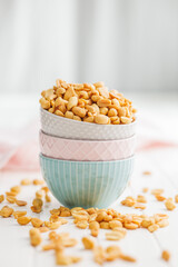 Sticker - Salted roasted peanuts in bowl on kitchen table