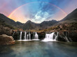 Scotland - Rainbow over Fairy pools waterfall in Isle of Skye, UK