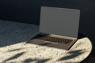 Wall Mural - Close up of modern designer desktop with empty mock up laptop on marble desk, sunlight and shadows. 3D Rendering.