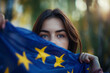 Young woman holds European flag