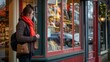 © liliyabatyrova - A woman wearing a red scarf stands in front of a store window
