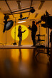 © Big Shot Theory - Videographer capturing footage in a yellow room with a camera