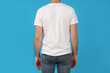 © Atlas - A young guy in a white t-shirt on a blue background