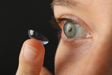 Sticker - Installation of a contact lens in the eye close-up