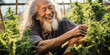 Holding a plant tenderly, a old man beams with delight, his smile infectious.