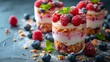 © PandaStockArt - Mixed berry parfait with layers in a clean and elegant setup. AI generate illustration