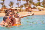 Fototapeta Do akwarium - Photo of relaxing vacation in Egypt Hurghada mother with son