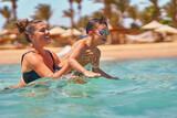 Fototapeta Do akwarium - Photo of relaxing vacation in Egypt Hurghada mother with son