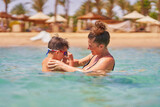 Fototapeta Do pokoju - Photo of relaxing vacation in Egypt Hurghada mother with son