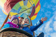 Family Adventure in Hot Air Balloon Under Blue Sky