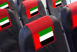 Fototapeta  - UAE Flag on Empty seat in plane. Travel, flight and transportration in United Arab Emirates concept