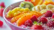 Pink smoothie bowl with berries and fruits